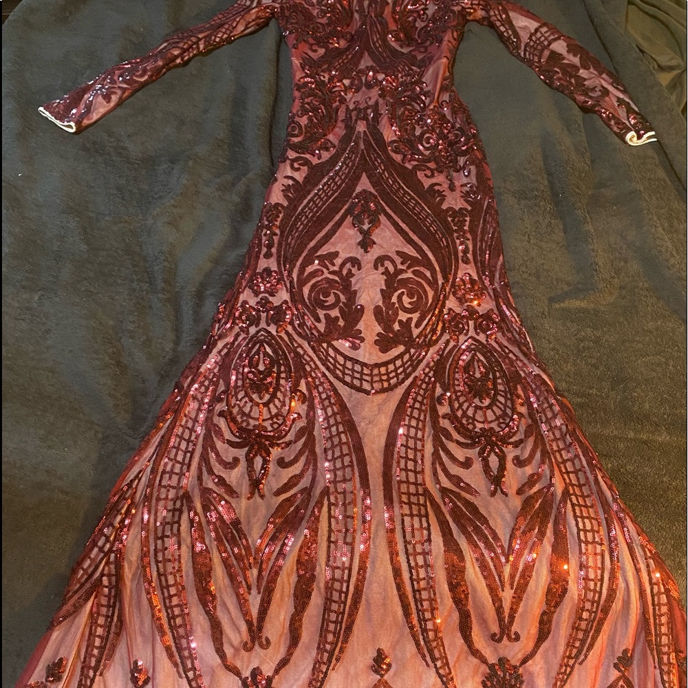 Beautiful sparkling maroon with beige inside lining dress with a flair bottom